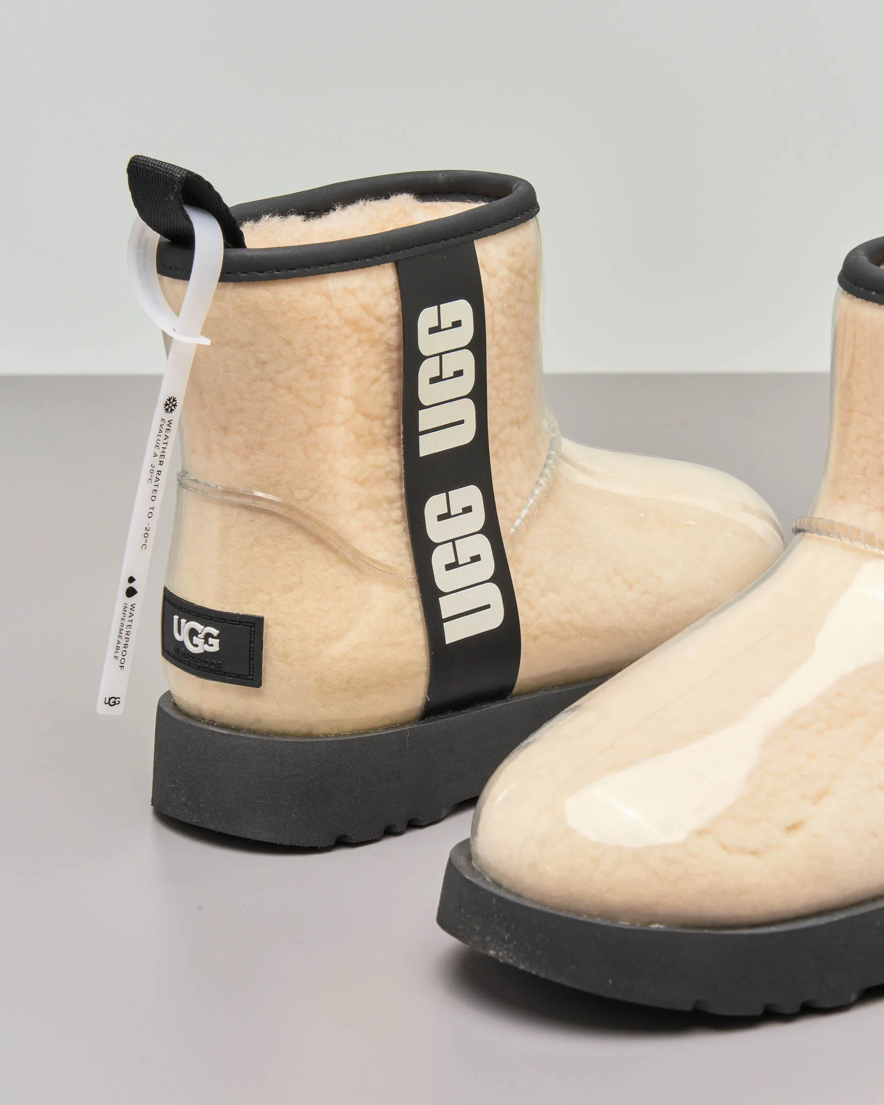 Mini stivale in montone color naturale ricoperto in gomma trasparente con scritta logo a contrasto 31-38