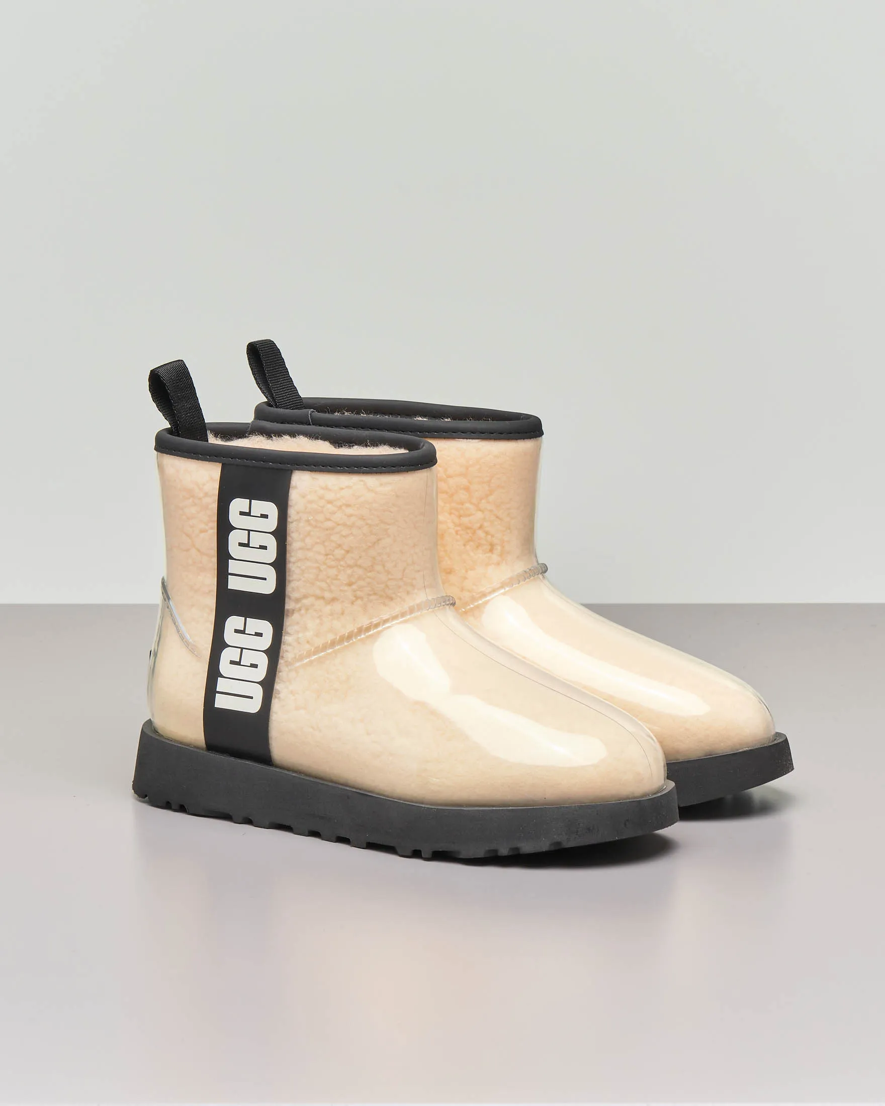 Mini stivale in montone color naturale ricoperto in gomma trasparente con scritta logo a contrasto 31-38