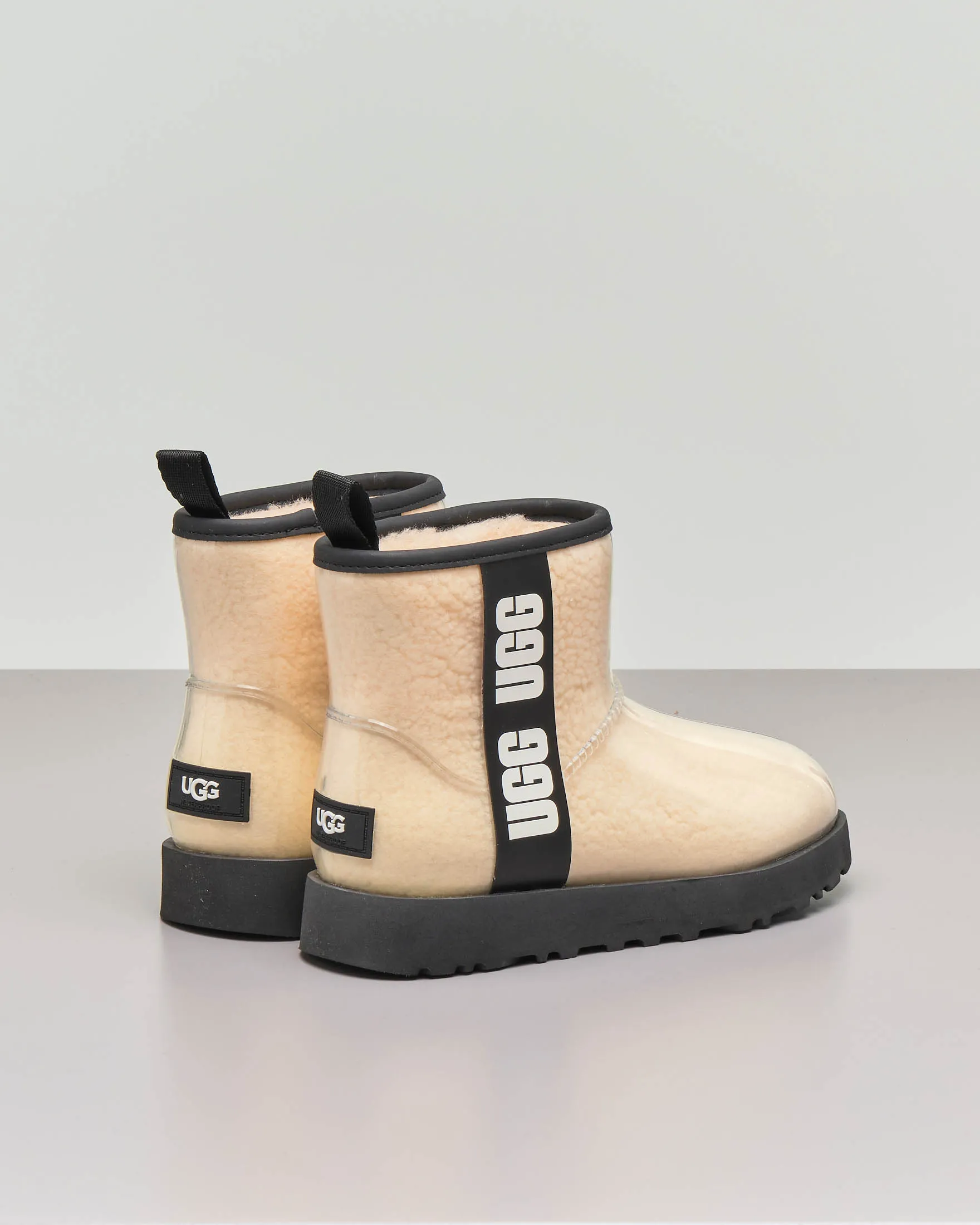 Mini stivale in montone color naturale ricoperto in gomma trasparente con scritta logo a contrasto 31-38