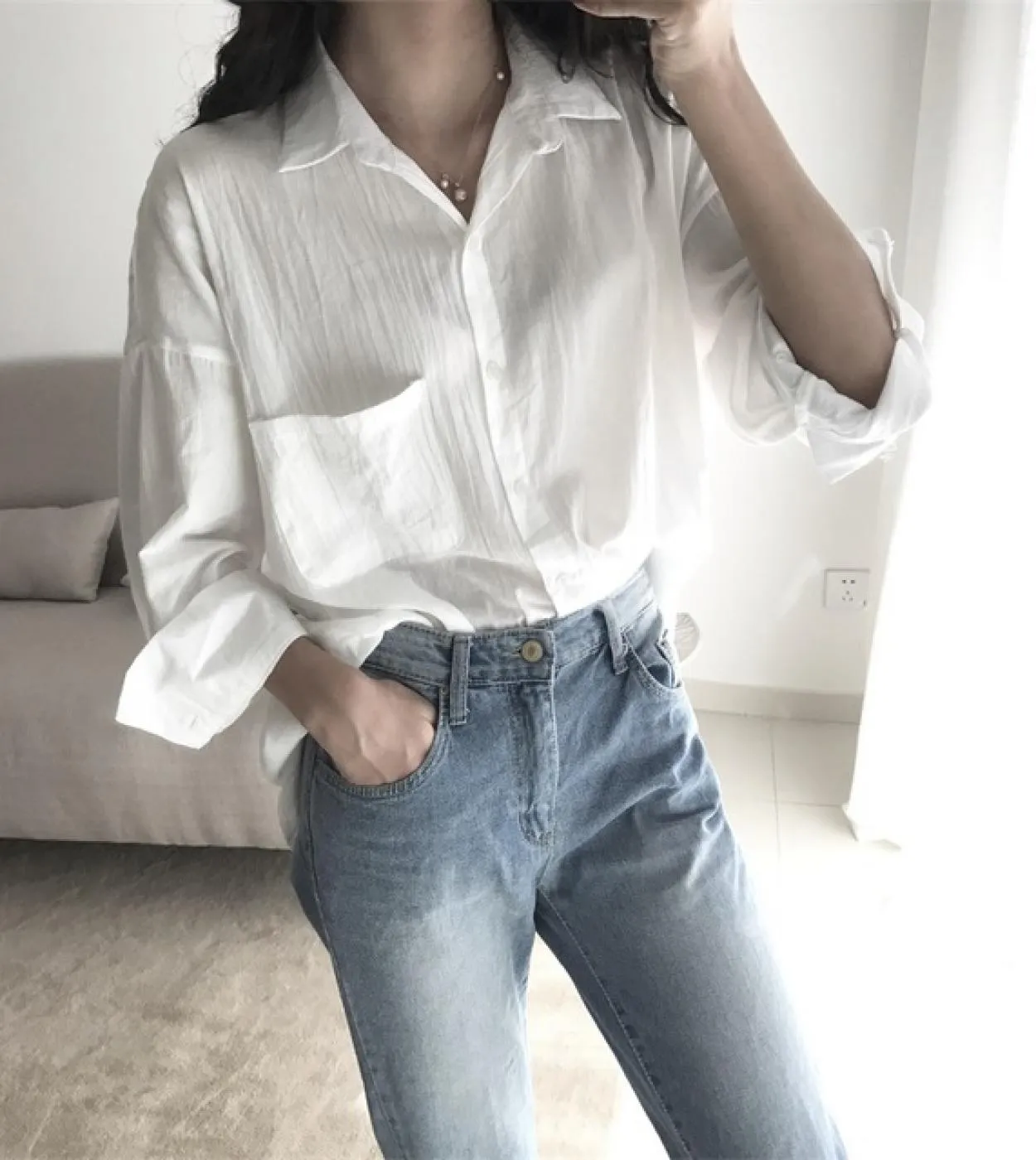 New Chic Casual Protezione solare Top Donna Autunno Stile Hong Kong Risvolto allentato Tinta unita Nona manica Camicia di media